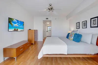 a bedroom with a bed and a ceiling fan at Le Marina Bay 1004 STR-02738 in Sunny Isles Beach