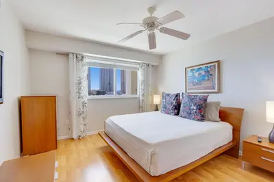 a bedroom with a bed and a ceiling fan at Le Marina Bay 1004 STR-02738 in Sunny Isles Beach