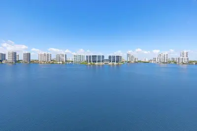 a large body of water with a city in the background at Le Marina Bay 1004 STR-02738 in Sunny Isles Beach