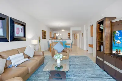 a living room with a couch and a table at Le Marina Bay 1004 STR-02738 in Sunny Isles Beach
