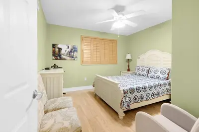 a bedroom with a bed and a ceiling fan at Le Marina Bay 1106 STR-03006 in Sunny Isles Beach