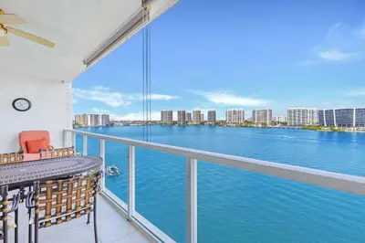 a balcony with a view of the water at Le Marina Bay 1106 STR-03006 in Sunny Isles Beach