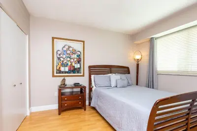 a bedroom with a bed and a picture on the wall at Le Marina Bay 403 STR-01408 in Sunny Isles Beach