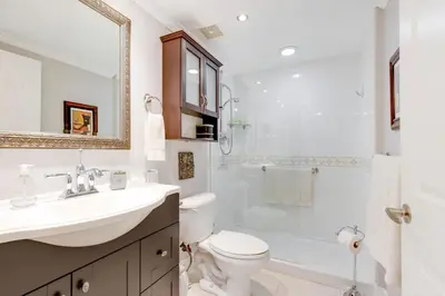 a bathroom with a sink and a toilet and a shower at Le Marina Bay 505 STR-02744 in Sunny Isles Beach