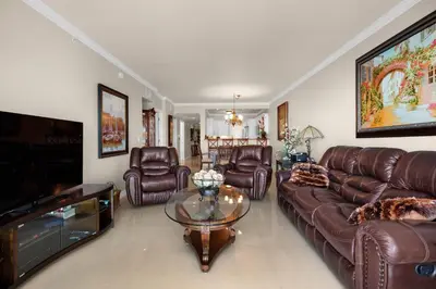 a living room with leather couches and a coffee table at Le Marina Bay 603 STR-02736 in Sunny Isles Beach