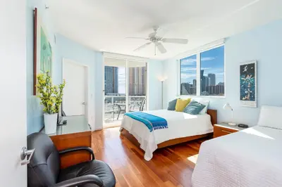 a bedroom with a bed and a large window at Le Marina Bay 801 STR-01477 in Sunny Isles Beach