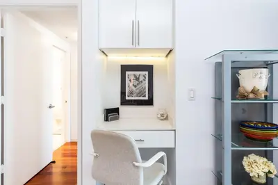 a room with a chair and a shelf at Le Marina Bay 801 STR-01477 in Sunny Isles Beach