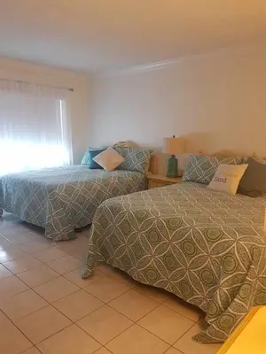 a bedroom with two beds and a window at Le Marbella 303 STR-02828 in Sunny Isles Beach