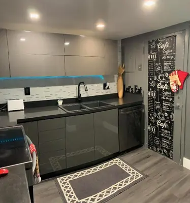 a kitchen with a sink and a chalkboard on the wall at Marbella Tower 706 STR-02489 in Sunny Isles Beach