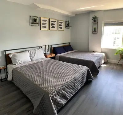 a bedroom with two beds and a window at Marbella Tower 706 STR-02489 in Sunny Isles Beach