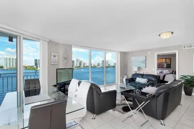 a living room with a view of the water at Le Montcalm 804 STR-01923 in Sunny Isles Beach