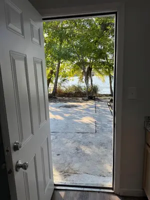 an open door with a view of a yard at Modern private efficiency Miami Gardens in Miami Gardens