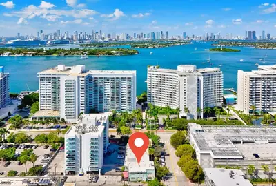 an aerial view of a city with a red marker at Beachside Escape with King Bed plus 2 Queens Miami in Miami Beach