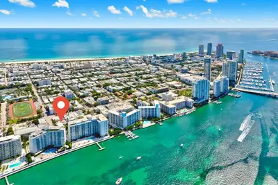 an aerial view of a city with a harbor at Beachside Escape with King Bed plus 2 Queens Miami in Miami Beach