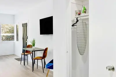 a kitchen and dining room with a table and chairs at Bright 1BR Miami Beach Stay Near the Ocean in Miami Beach
