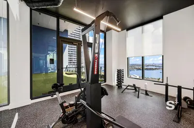 a fitness room with a gym with windows at Downtown Miami - Luxury Condo with City Views in Miami