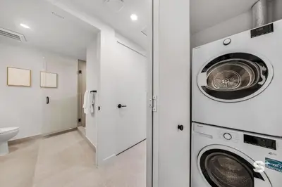 a laundry room with a washer and dryer at Cozy and Spacious Studio in Miami City Views in Miami