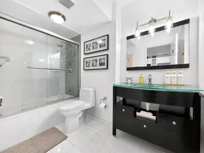 a bathroom with a sink and a toilet and a shower at Miami Beach Studio with shared Heated Pool & Gym in Miami Beach