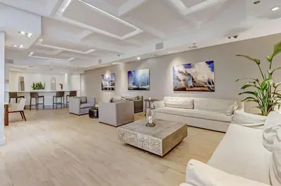a large living room with couches and a table at Miami Beach Studio with shared Heated Pool & Gym in Miami Beach