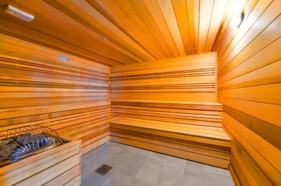 a sauna with wood paneled walls and a wooden ceiling at Modern Escape in Brickell w Pool & Gym in Miami