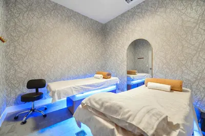 a hospital room with two beds and a mirror at Modern Escape in Brickell w Pool & Gym in Miami
