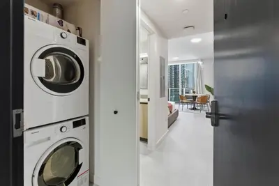 a laundry room with a washer and dryer in a house at 501 First Residences in Miami