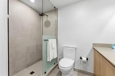 a bathroom with a toilet and a shower at 501 First Residences in Miami