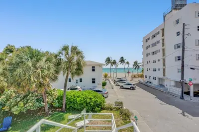 a view of the beach from the balcony of a building at Oceanfront Residence by Atlantikos in Hollywood