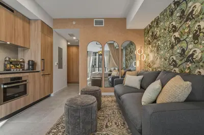 a living room with a couch and a kitchen at New Luxury Studio Downtown Miami Prime Location in Miami