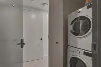 a white washer and dryer in a room at New Luxury Studio Downtown Miami Prime Location in Miami