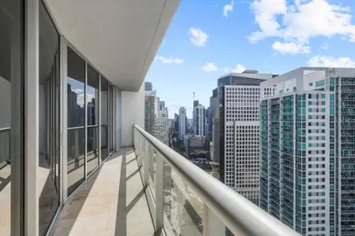 an apartment balcony with a view of the city at The Palazzo, Heart of Miami, Rooftop Pool, Lux Spa in Miami