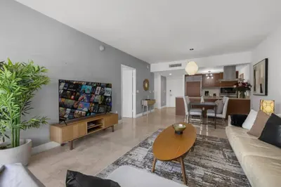 a living room with a couch and a table at The Palazzo, Heart of Miami, Rooftop Pool, Lux Spa in Miami