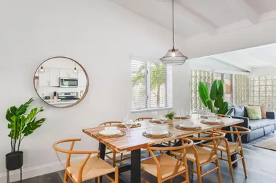 a dining room with a table and chairs at Waterfront Pool Home to Few Minutes to Beach in Fort Lauderdale