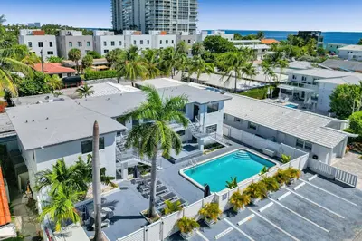 an aerial view of a building with a swimming pool at Desoto Beach Retreat with Heated Pool - By Atlantikos in Hollywood
