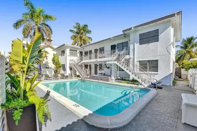 an exterior view of a house with a swimming pool at Desoto Beach Retreat with Heated Pool - By Atlantikos in Hollywood