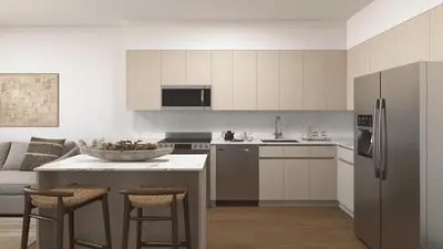 a kitchen with white cabinets and a bowl of fruit on a counter at Sleeps 20 3 Suites in New Luxury Hotel w Rooftop Pool Sense28 by AvantStay in Miami