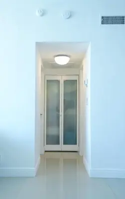 an empty corridor with a door in a building at The Tides on Hollywood Beach in Hollywood