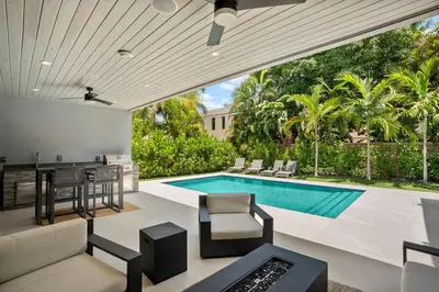 a living room with a swimming pool and a house at New construction Fort Lauderdale luxury villa with Pool in Fort Lauderdale