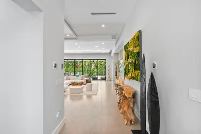 a living room with a couch and a table at New construction Fort Lauderdale luxury villa with Pool in Fort Lauderdale