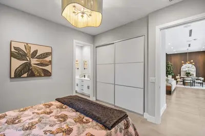 a bedroom with a bed and a sliding glass door at New construction Fort Lauderdale luxury villa with Pool in Fort Lauderdale
