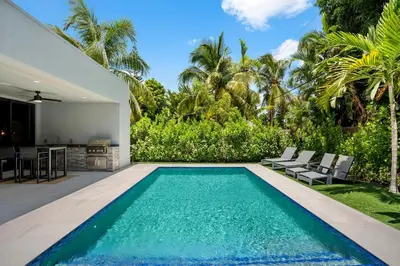 an image of a swimming pool in the backyard of a house at New construction Fort Lauderdale luxury villa with Pool in Fort Lauderdale