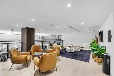 a lobby with chairs and tables in a building at Free Parking Downtown Condo Resort Amenities in Miami