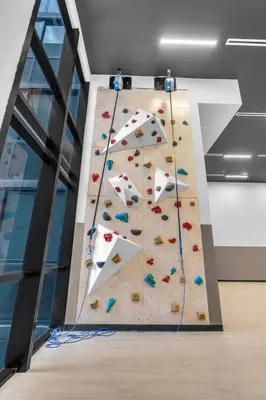 an indoor climbing wall in a room with at Free Parking Downtown Condo Resort Amenities in Miami