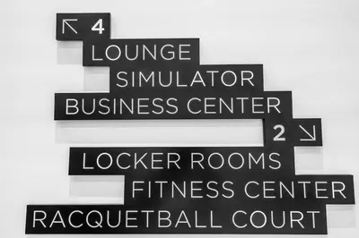 a group of black signs on a wall at Free Parking Downtown Condo with Resort Amenities in Miami