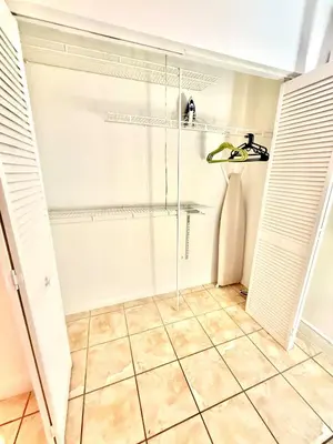 a bathroom with a shower and a tiled floor at Best location in Coconut Grove in Miami