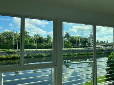 a view of a river from a window at Spring Village by the Canal Loft in Miami