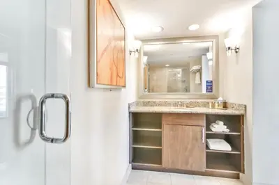 a bathroom with a sink and a mirror at Intracoastal Oasis in Fort Lauderdale