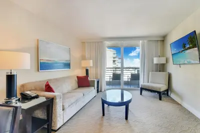 a living room with a couch and a table at Intracoastal Oasis in Fort Lauderdale