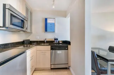 a kitchen with a sink and a dishwasher at Intracoastal Oasis in Fort Lauderdale