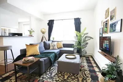 a living room with a couch and a tv at Alton Apts By At Mine Hospitality in Miami Beach